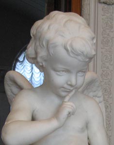 Sabian Symbol Sagittarius 7: Cupid knocking at the door.